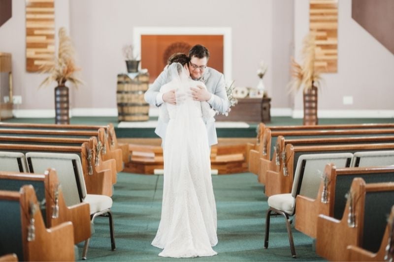 bride and groom embracing on their wedding day