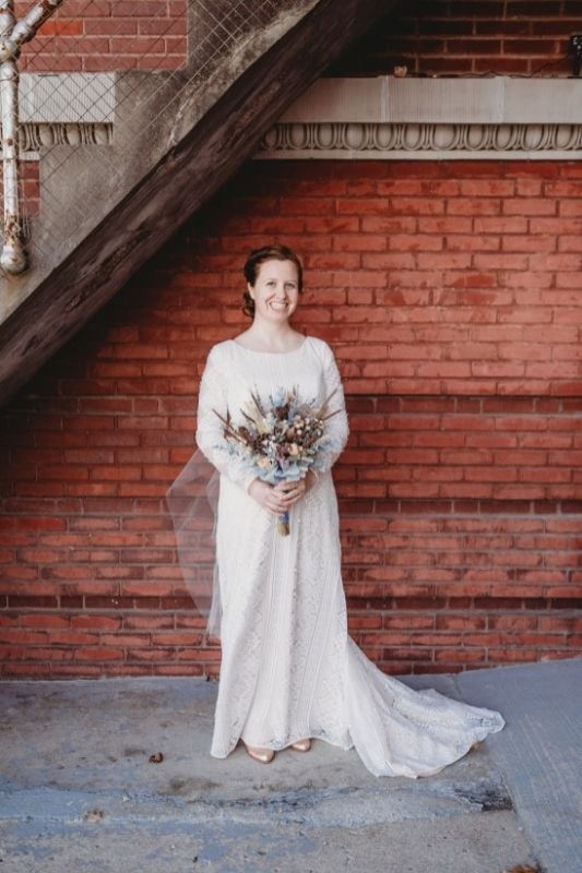 real bride on her wedding day in her wedding dress