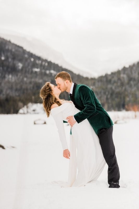 winter wedding season and the groom is in a green velvet tux