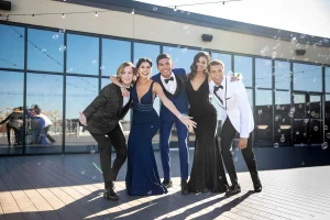 Group Of Teens At Prom In Suits And Dresses