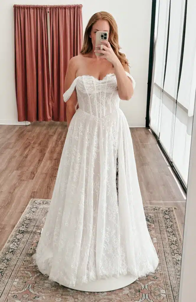 Women Trying On Wedding Dress Creating Content