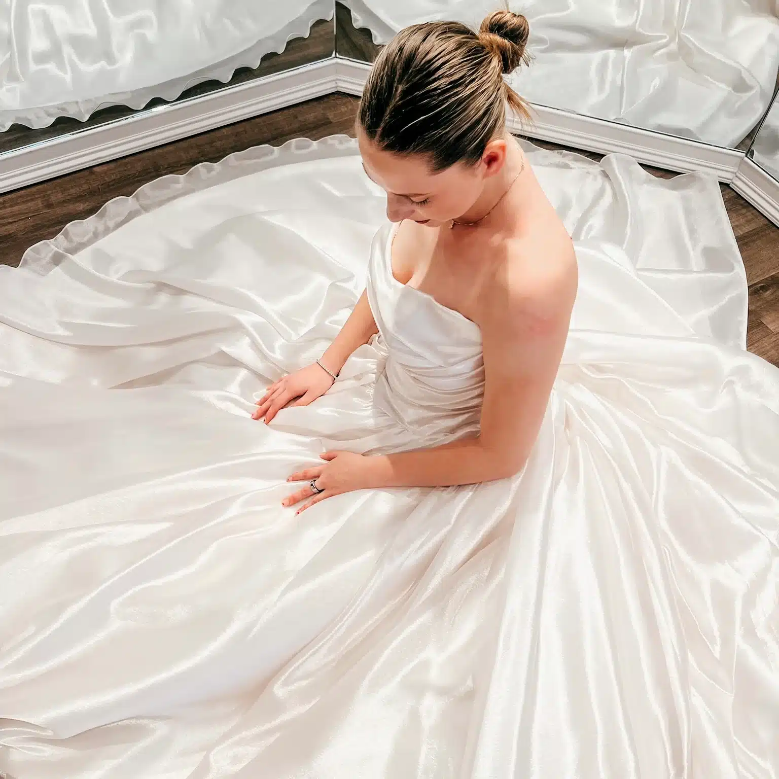 Bride On Ground In Front Of Mirrors In Ball Gown Wedding Dress Bride On Ground In Front Of Mirrors In Ball Gown Wedding Dress