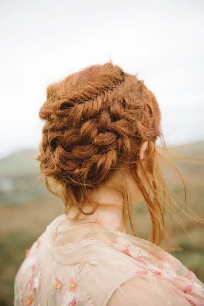 Women With Ginger Red Hair In Intricate Braided Hairstyle For Wedding