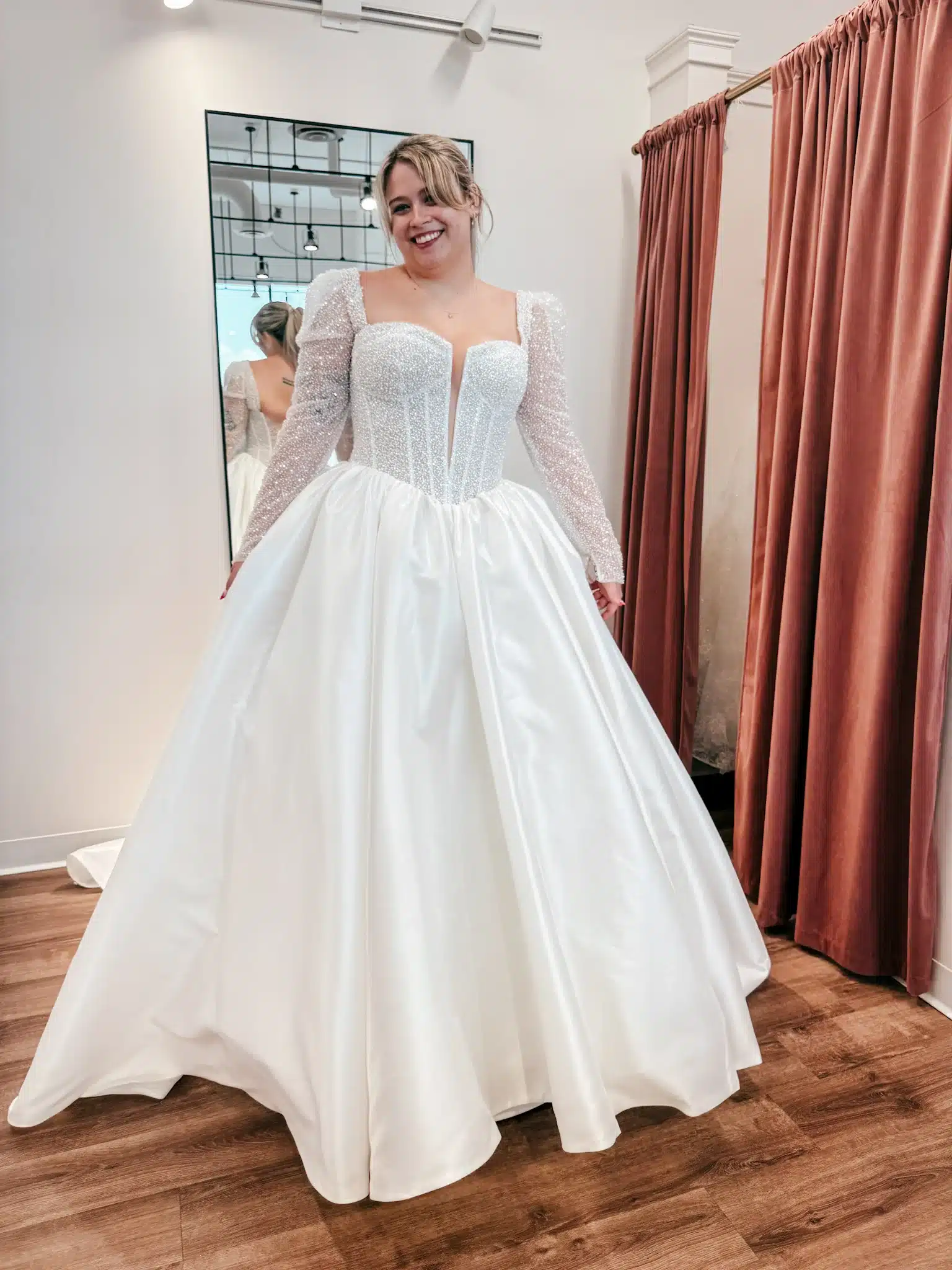 Bride Trying On Winter Wedding Dress With Embellishments Bride Trying On Winter Wedding Dress With Embellishments