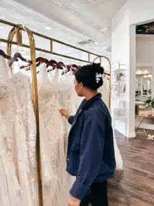Client Browsing Bridal Wedding Dress Racks At Sophias Bridal Before Trying On Dresses
