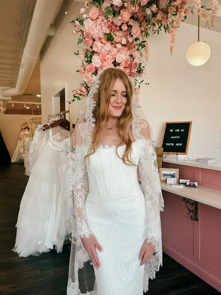 Bride Trying On Wedding Dress With Veil In Prep For Wedding Season Bride Trying On Wedding Dress With Veil In Prep For Wedding Season
