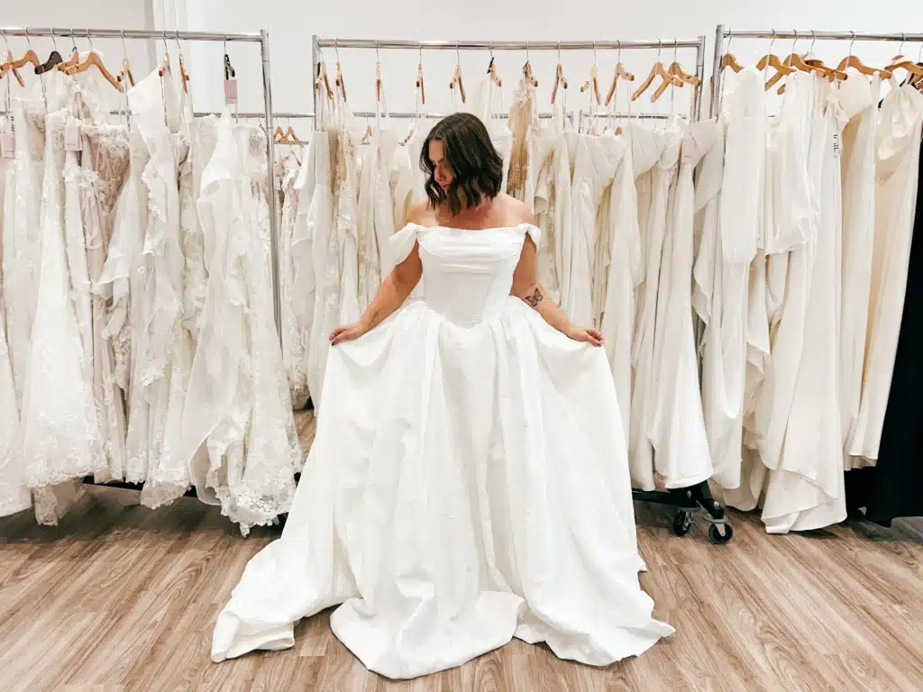 Bride Trying On And Posing In Long White Wedding Dress At Sophia's Louisville Ky Store