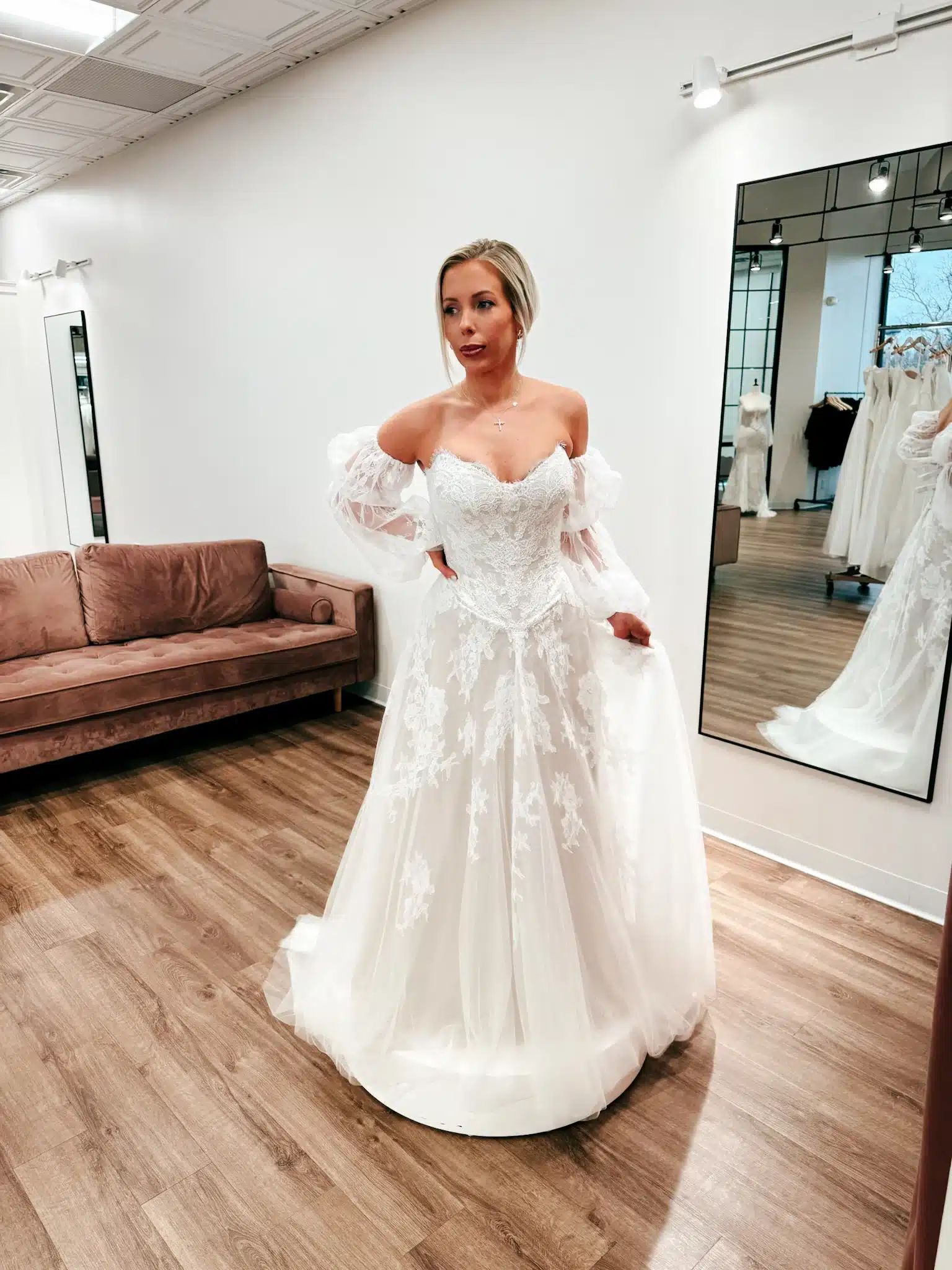 Bride Trying On Boho Style Wedding Dress At Sophias Bridal In Indianapolis With Detachable Sleeves Bride Trying On Boho Style Wedding Dress At Sophias Bridal In Indianapolis With Detachable Sleeves