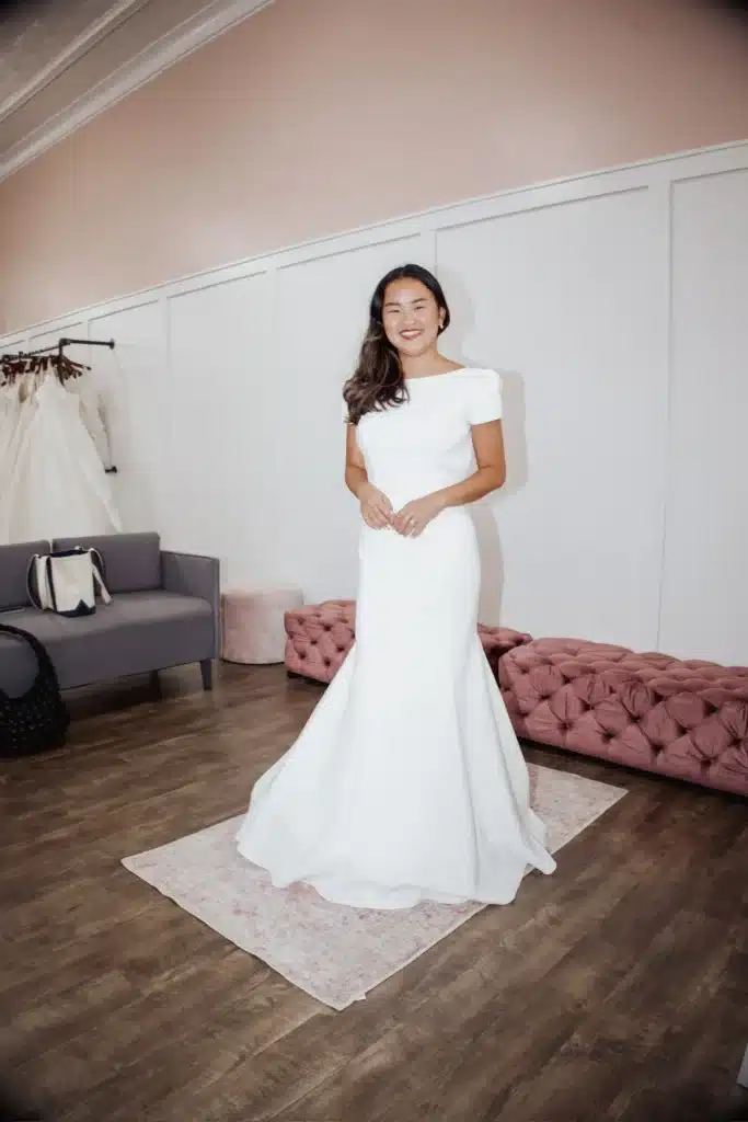 Bride Trying On Modern Classy Wedding Dress For Last Minute Summer Wedding