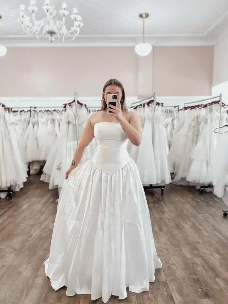 Bride Taking Mirror Selfie Of Discount Off The Rack Wedding Dress