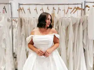 Client Trying On Wedding Dress In Indianapolis Bridal Boutique