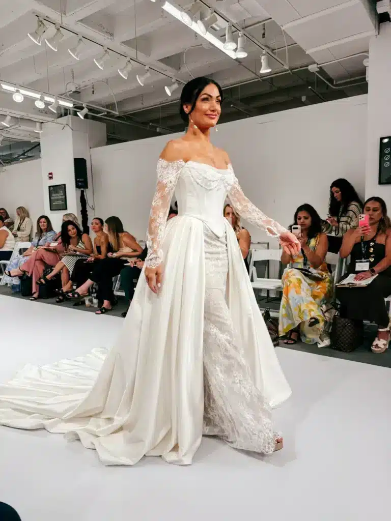 Bridal Show With Model Wearing Sophia Bridal Gown On Runway