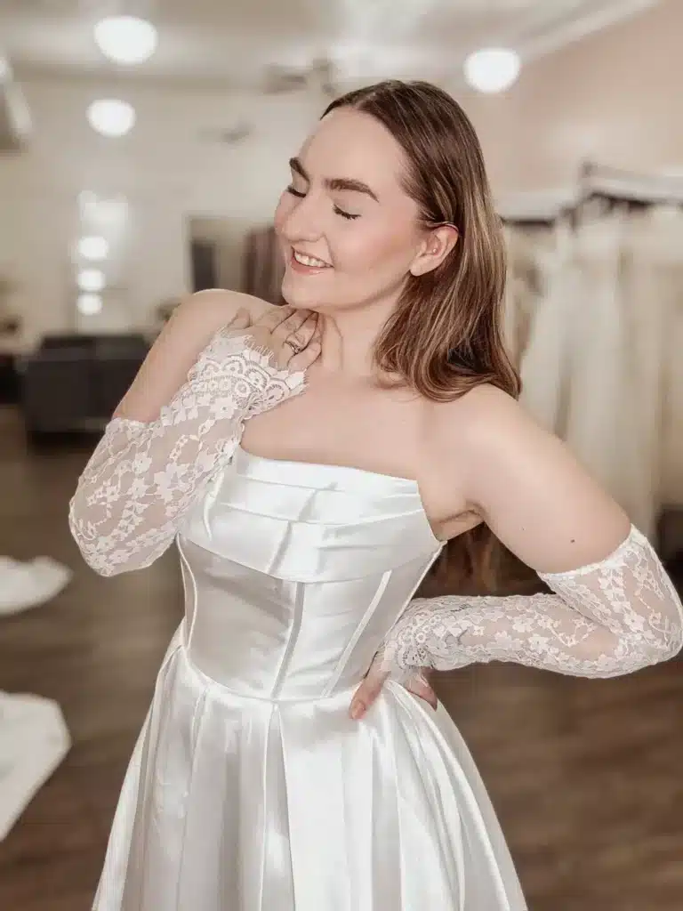Close Up Of Bride Posing And Styling Wedding Dress