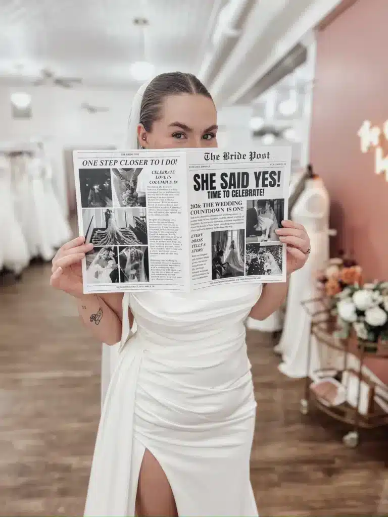 Bride Holding She Said Yes Newspaper While Wearing Bridal Dress