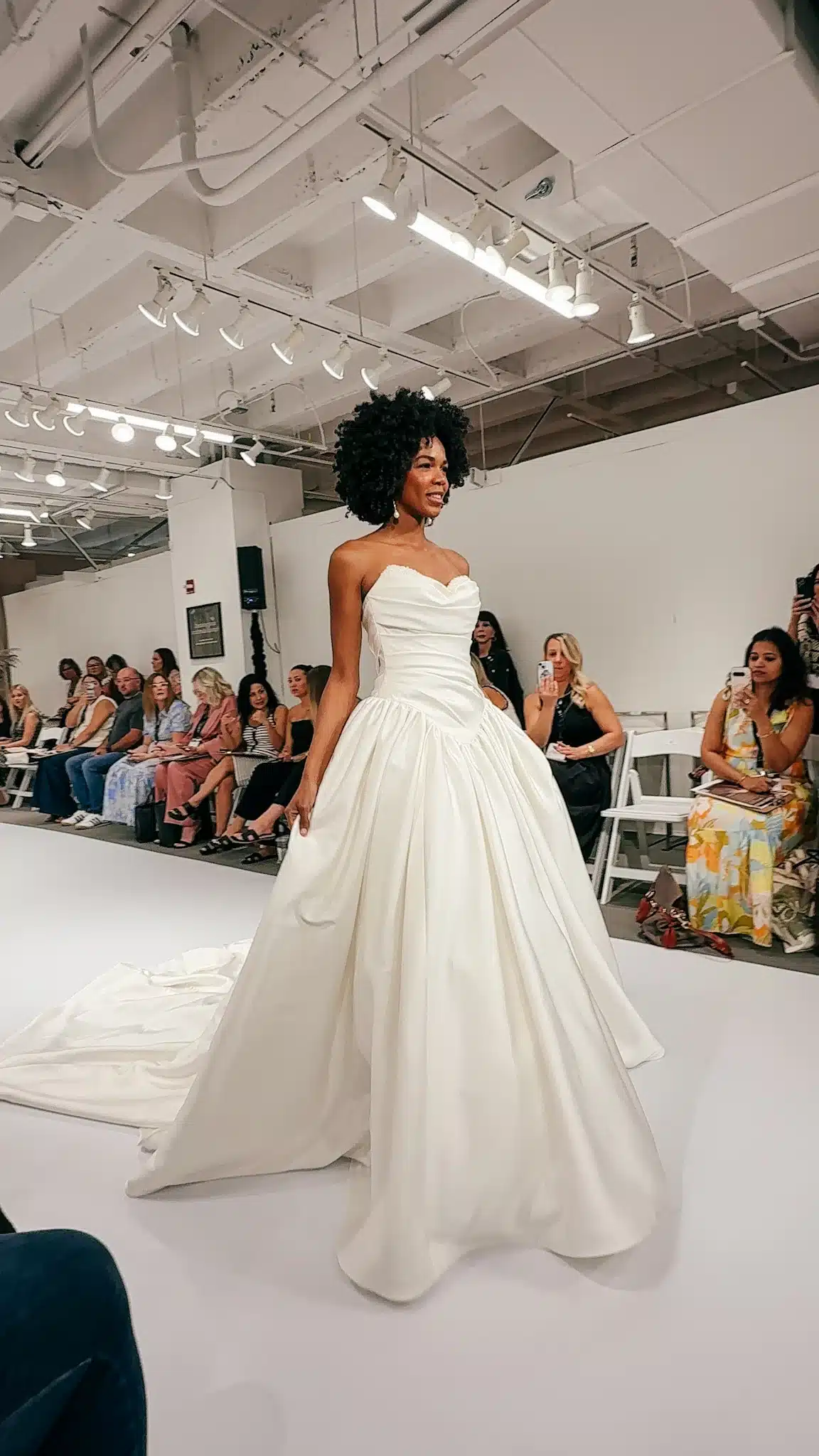 Model Wearing Ruched White Wedding Dress Walking On Runway Model Wearing Ruched White Wedding Dress Walking On Runway
