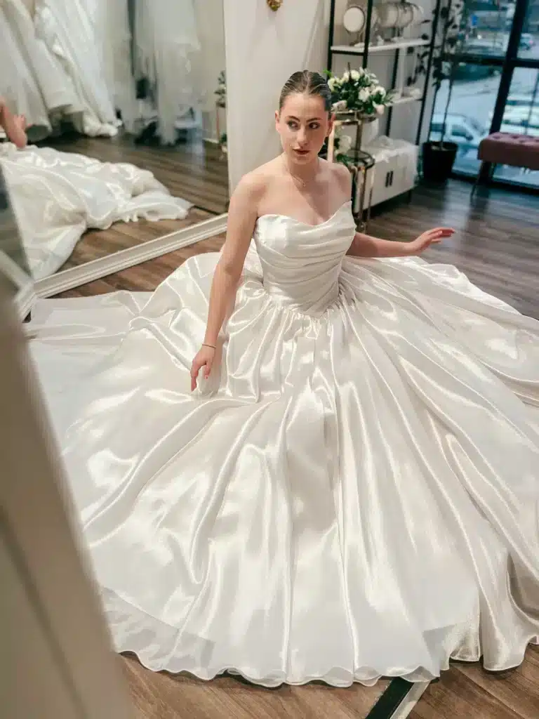 Satin White Wedding Dress With Bride Sitting On Floor