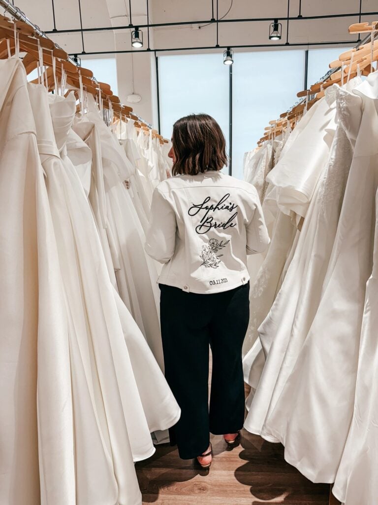 Bride browsing wedding gowns while planning her wedding timeline