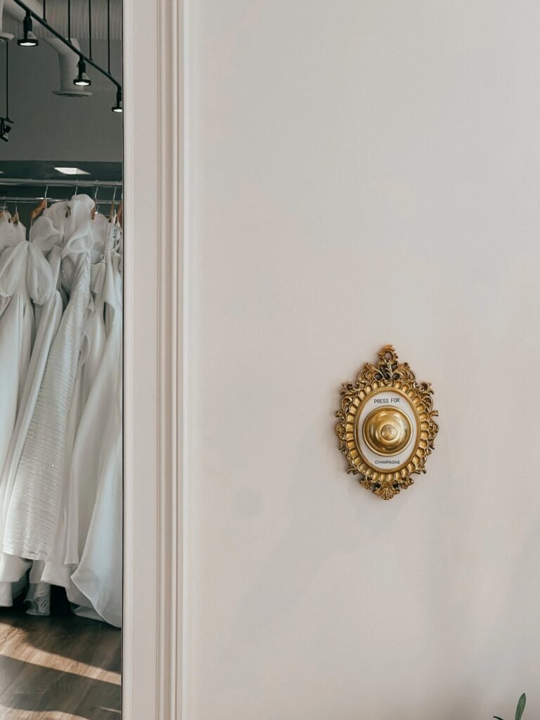 Champagne button and wedding dresses at Sophia’s Bridal & Tux