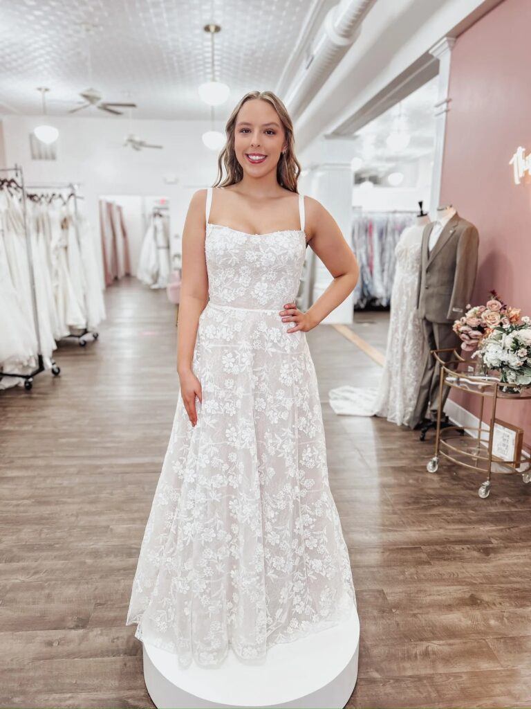 Bride trying on elopement dresses at With Love, Sophia's in Columbus